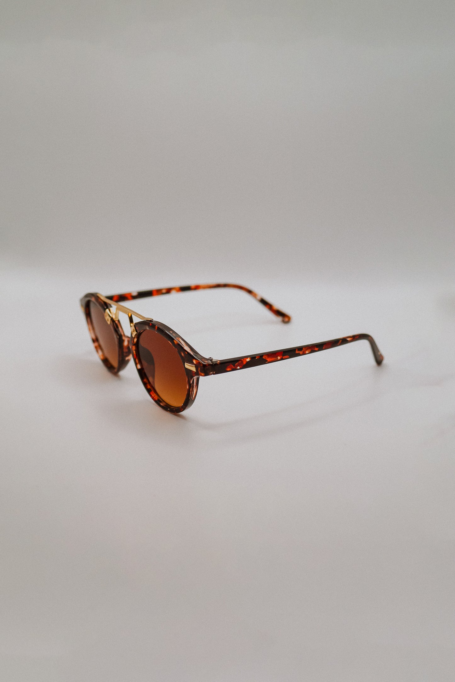 Round Tortoiseshell Sunglasses with Gold Bridge