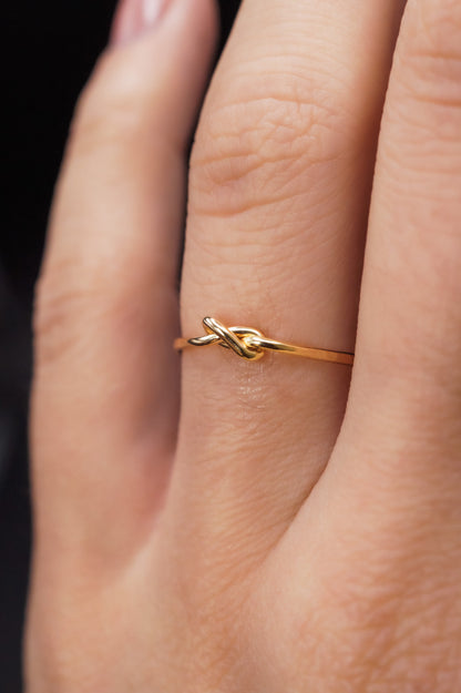 Modeled example of the Thick Closed Knot Ring in 14k Gold Fill on ring finger.